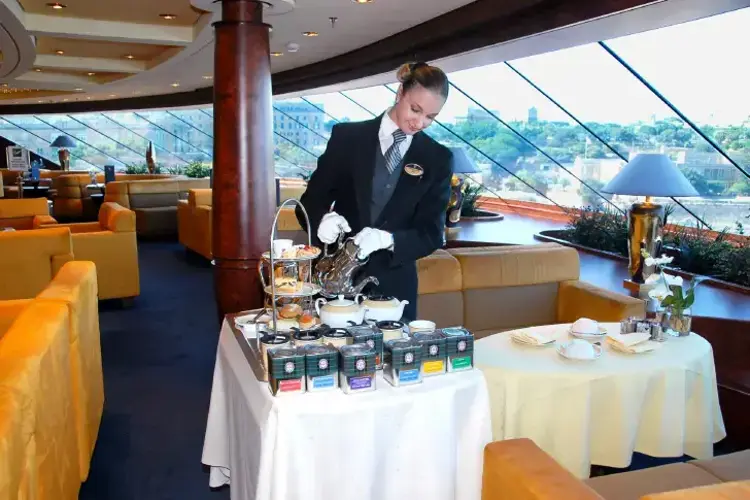 MSC13011427MSC Fantasia Fantasia Class MSC Yacht Club Staff Butler Life On Board Tea Pastry Top Sail Lounge.webp